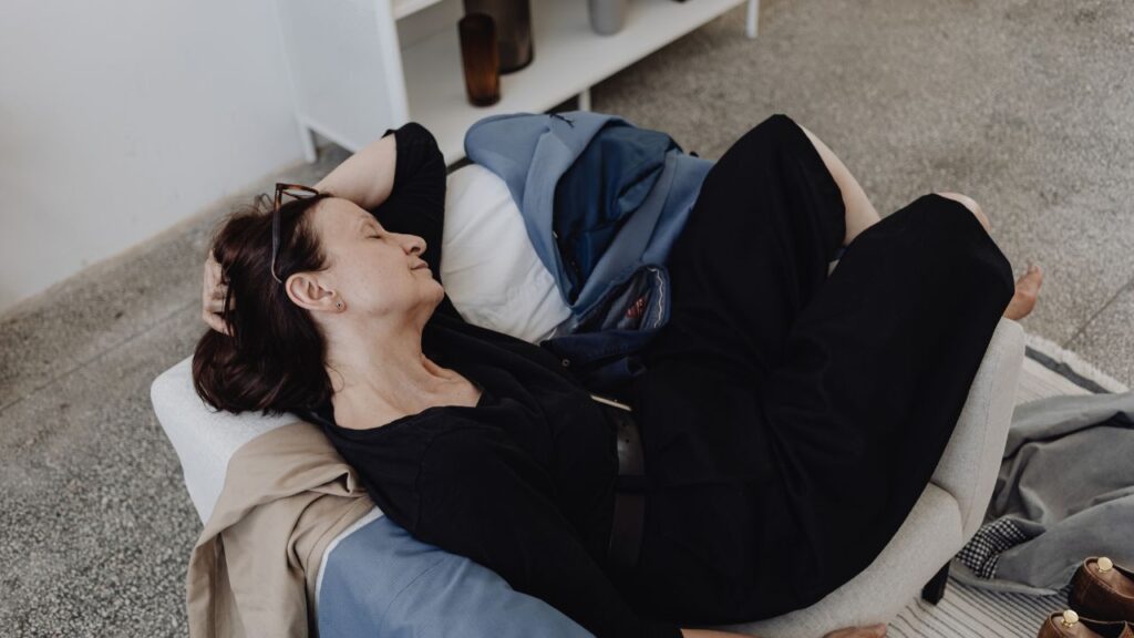 woman tired sleeping in sofa