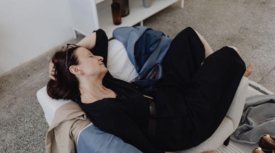 woman tired sleeping in sofa