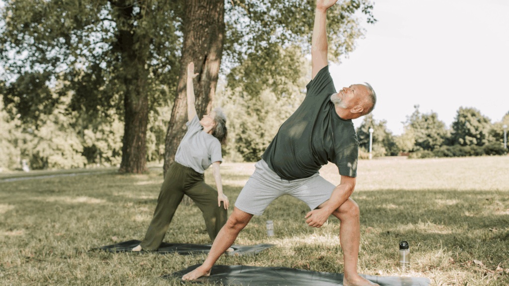 two adults doing yoga