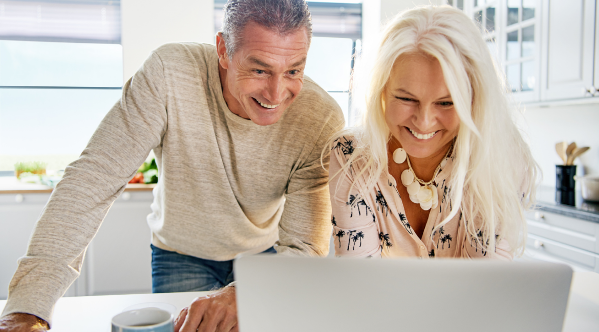 middle age couple in laptop